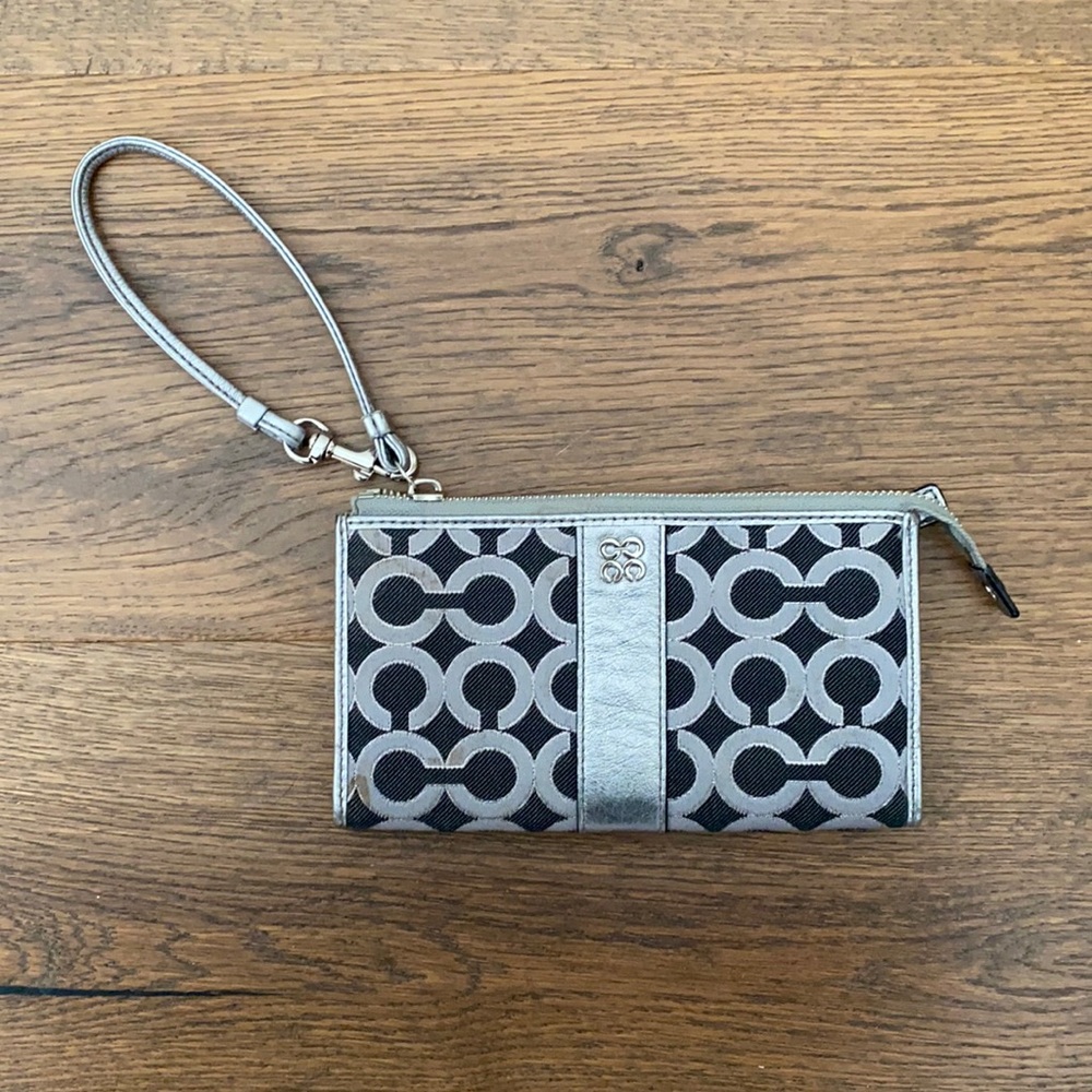 Coach wristlet. Silver and navy with pink lining.
